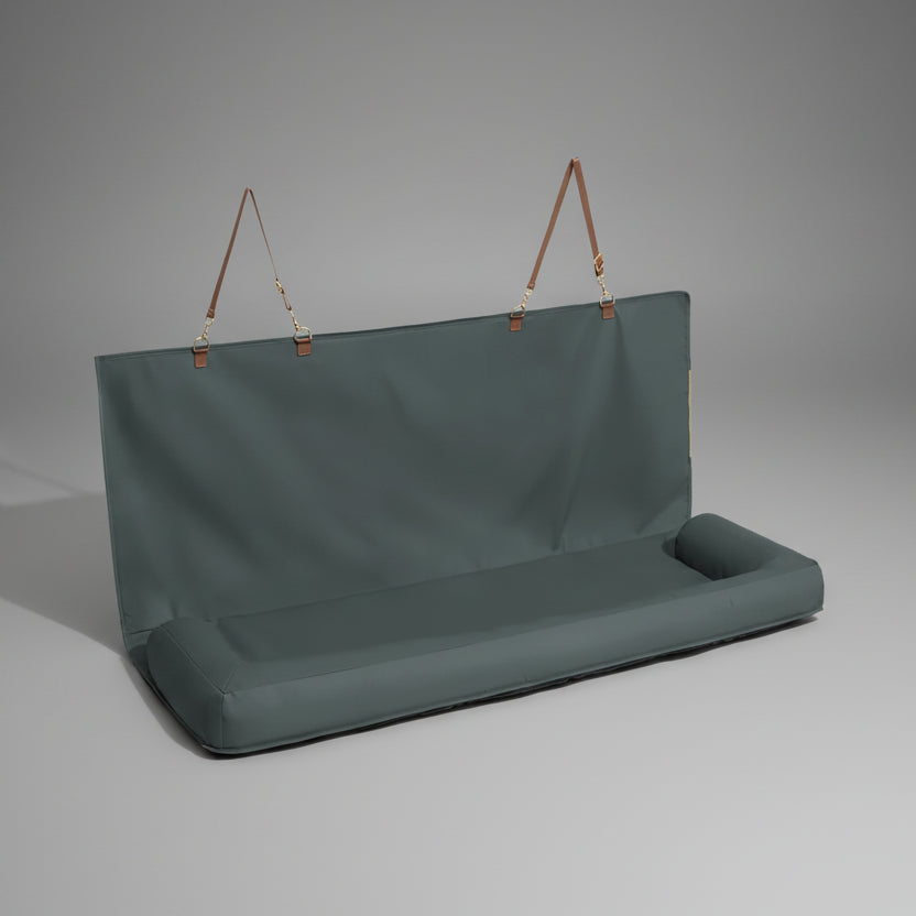 Dark green hanging bench with brown straps on a white background