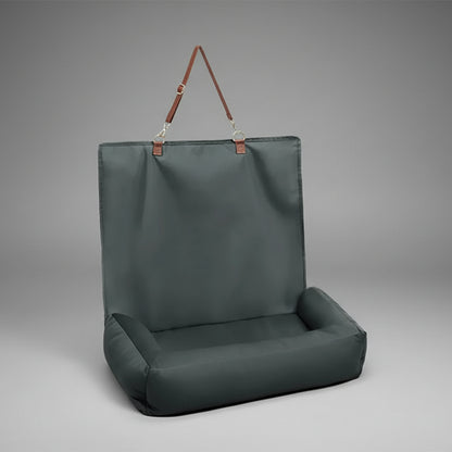 Dark green inflatable chair with handle on a white background