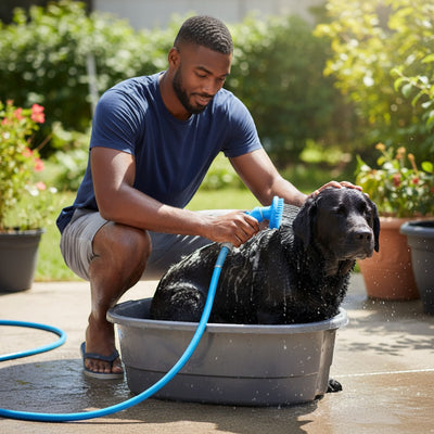 FURRYKU blue 2-in-1 dog shower brush with silicone bristles and integrated sprayer, attached to a hose.