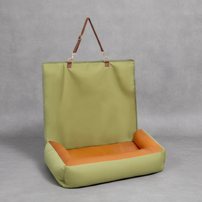 Green and orange chair with a handle on a white background
