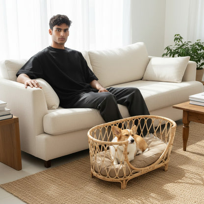 FURRYKU handmade natural rattan dog bed sofa with beige cushion, oval shape, woven design for ventilation and support.