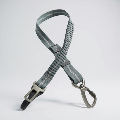 FURRYKU grey adjustable retractable dog car seat belt with elastic shock-absorption and zinc alloy clip.